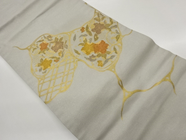 金通し手描き金彩花葉模様名古屋帯